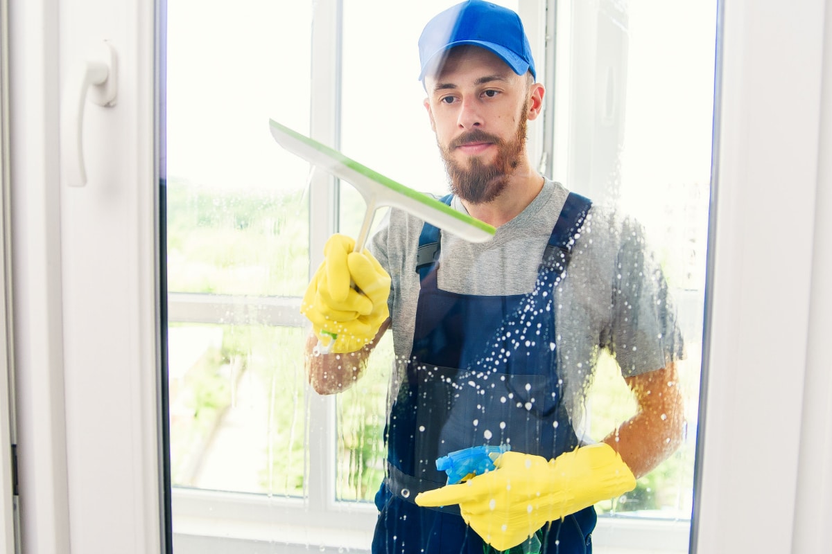 man works as a window cleaner