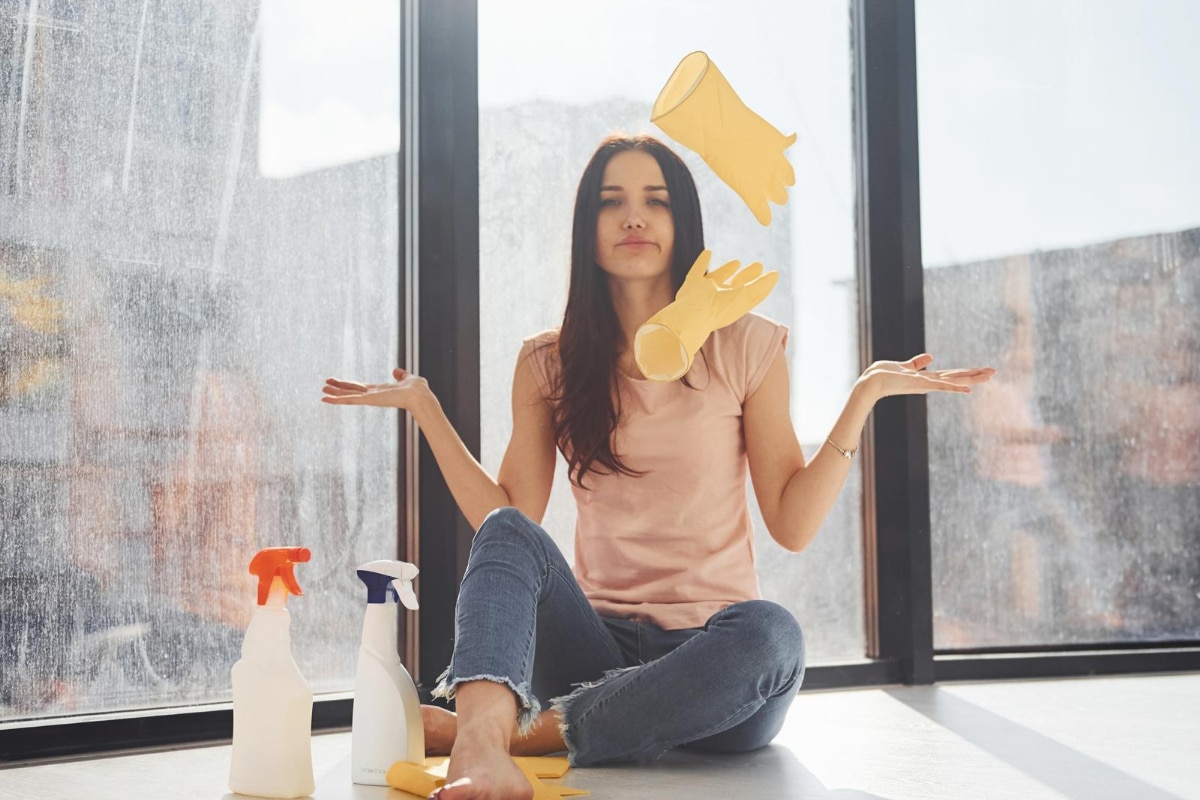 woman tired of cleaning apartment windows